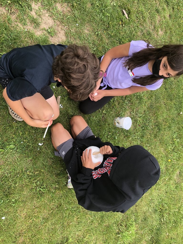 three students working egg challenge