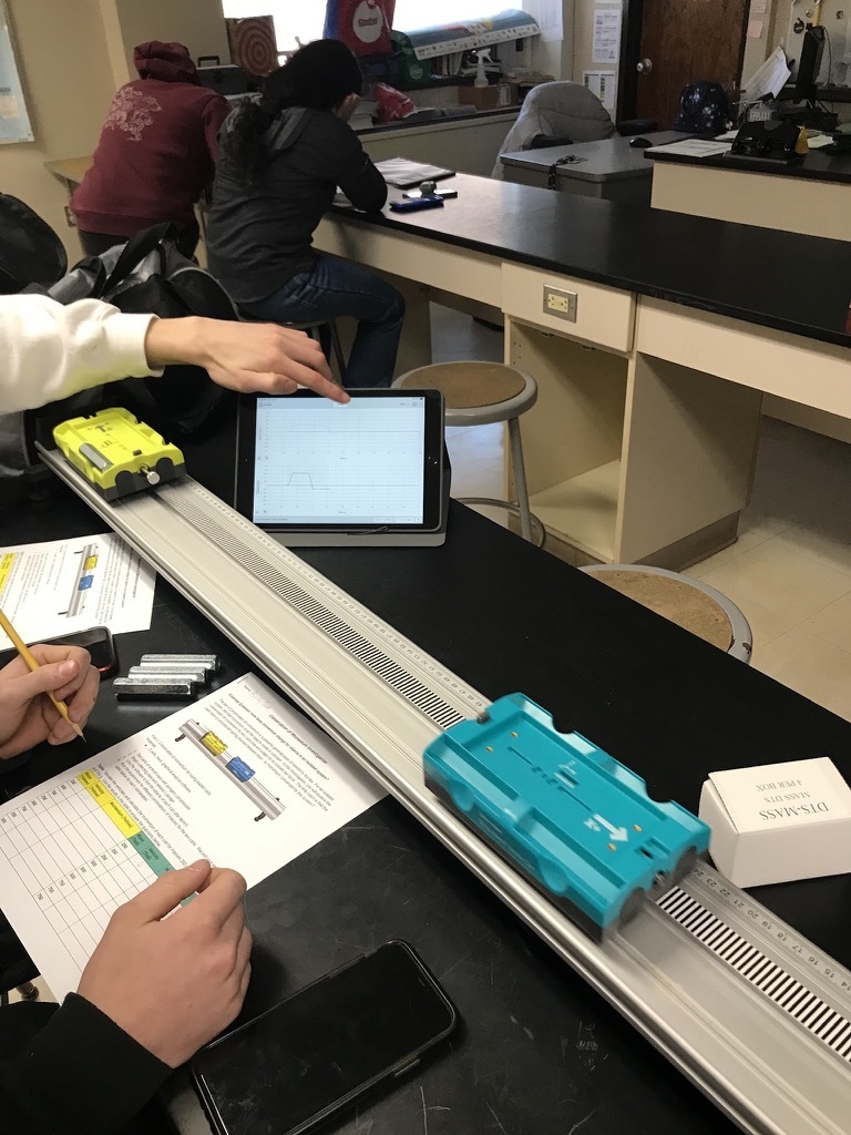 Wamogo Physics students are using bluetooth enabled carts to collect data in real time to study the law of conservation of momentum in a closed system.